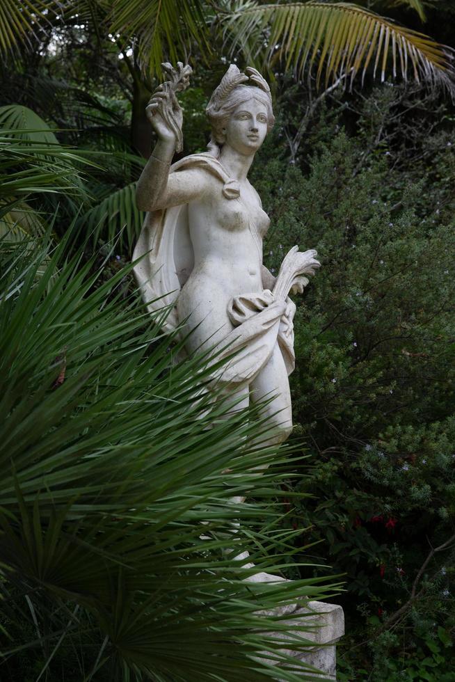 Ancient marble sculpture in the park photo