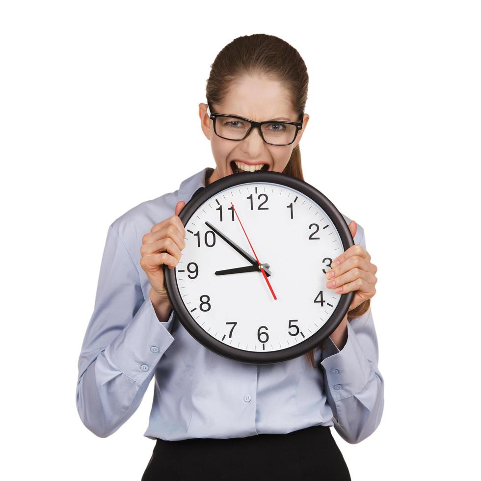 Girl in a state of stress bites the clock photo