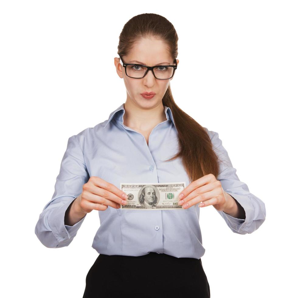 Woman with disdain holding hundred dollar bill photo