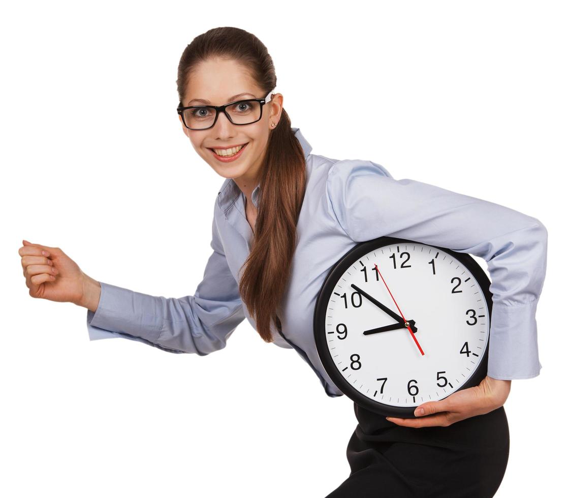 Girl with glasses runs with a clock in his hands photo