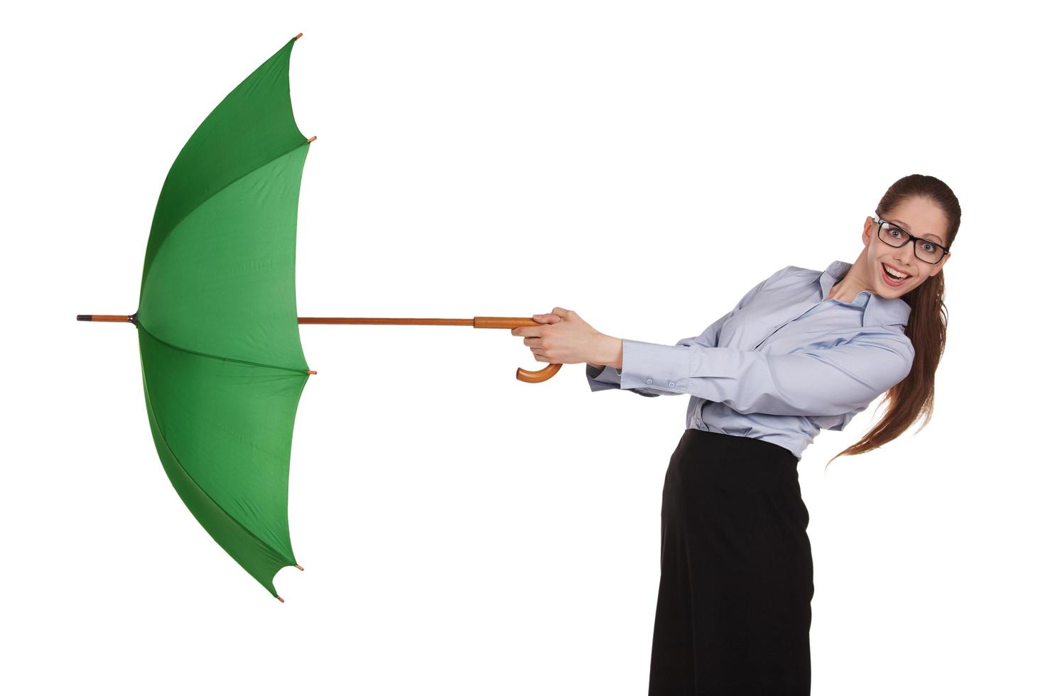 Girl pulls to itself open umbrella photo