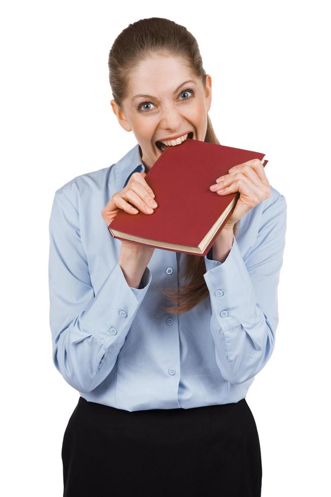 Nervous woman tries to bite a book photo