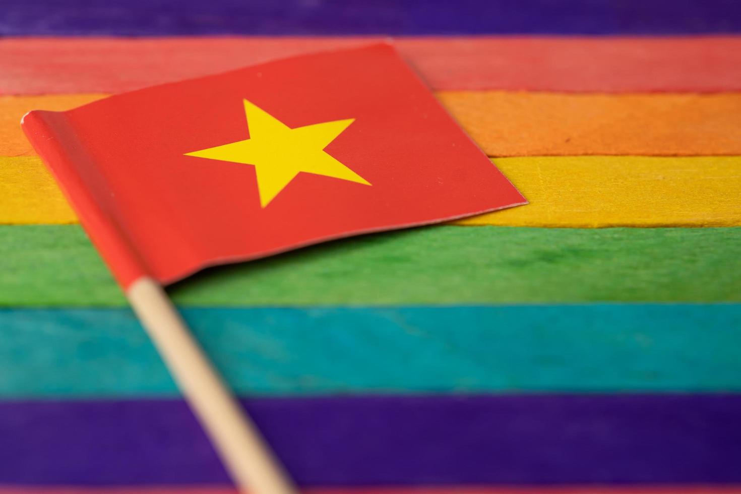 China flag on rainbow background symbol of LGBT gay pride month photo