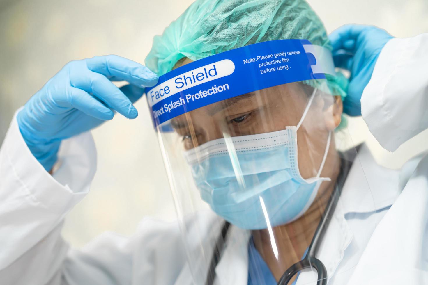 Asian doctor wearing PPE suit for protect coronavirus. photo