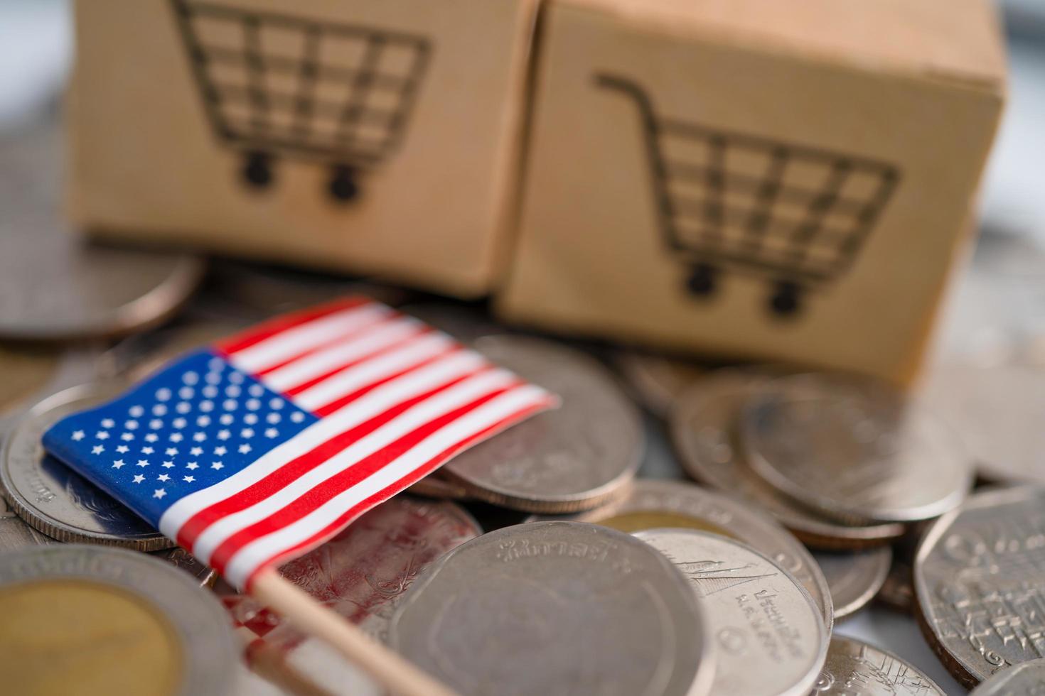 Stack of coins, shopping cart box with USA America flag photo