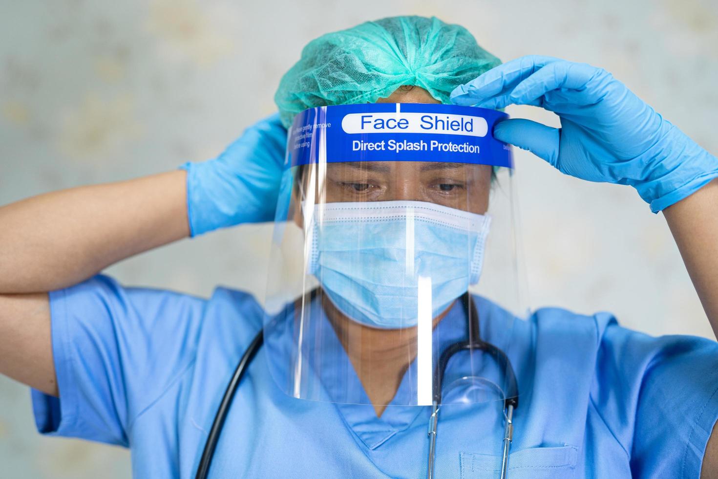 Asian doctor wearing PPE suit protect Covid-19 Coronavirus photo