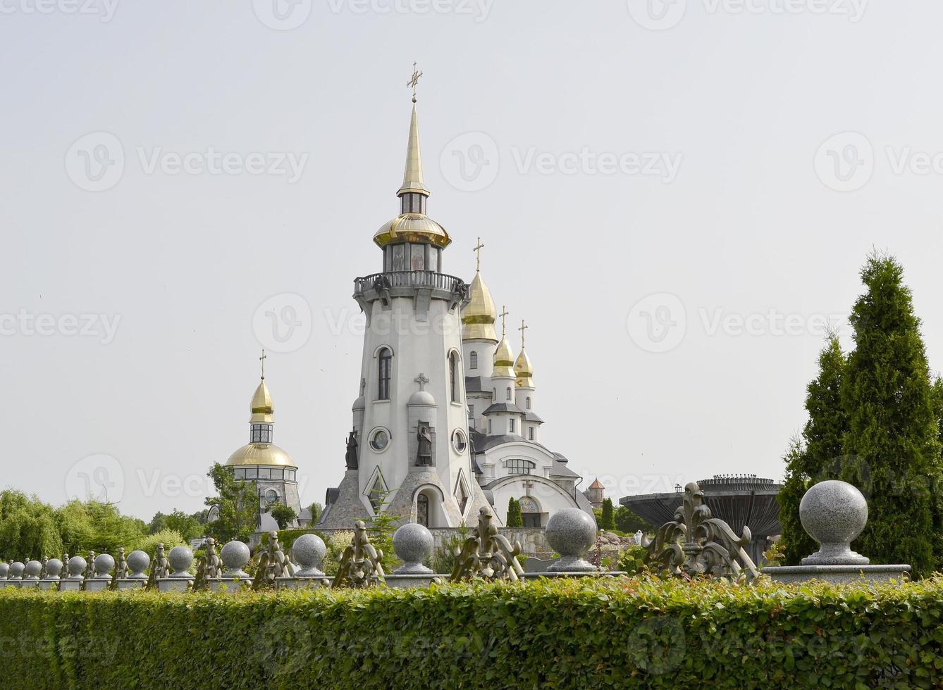 Christian church cross in high steeple tower for prayer photo