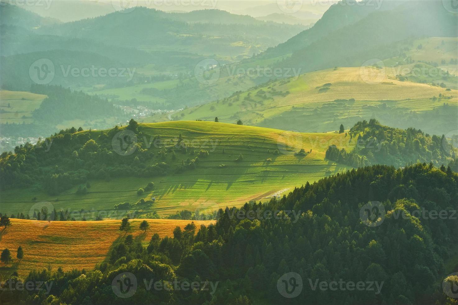 Sun over the mountains in summer photo