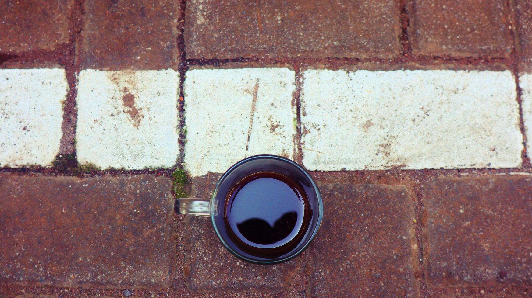 Glass of coffee on block texture photo