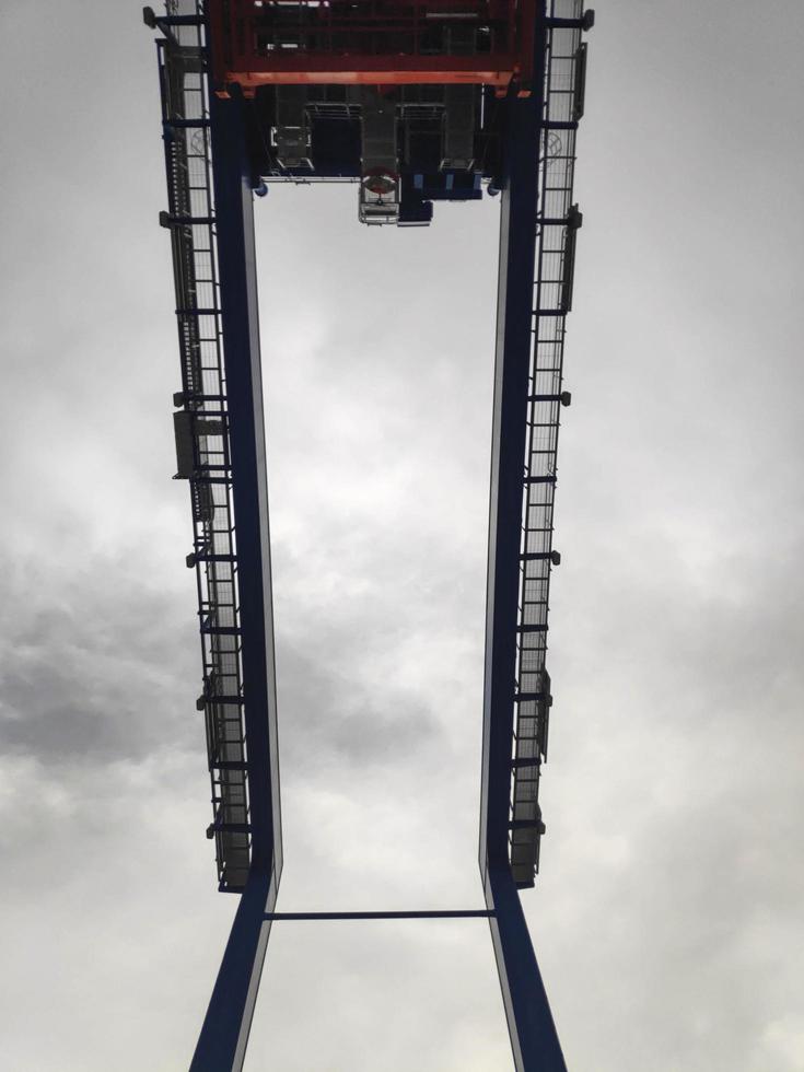 Sorong, West Papua, Indonesia 2021- A Rubber Tyred Gantry Crane on the yard of Sorong Harbour photo