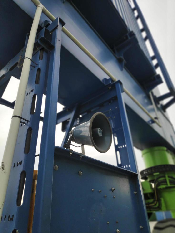 Sorong, West Papua, Indonesia 2021- A Rubber Tyred Gantry Crane on the yard of Sorong Harbour photo