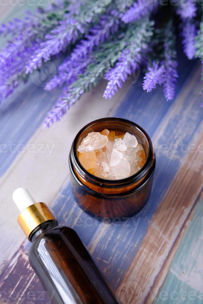 Herbal Lavender Salt And Essential Oil On Table photo