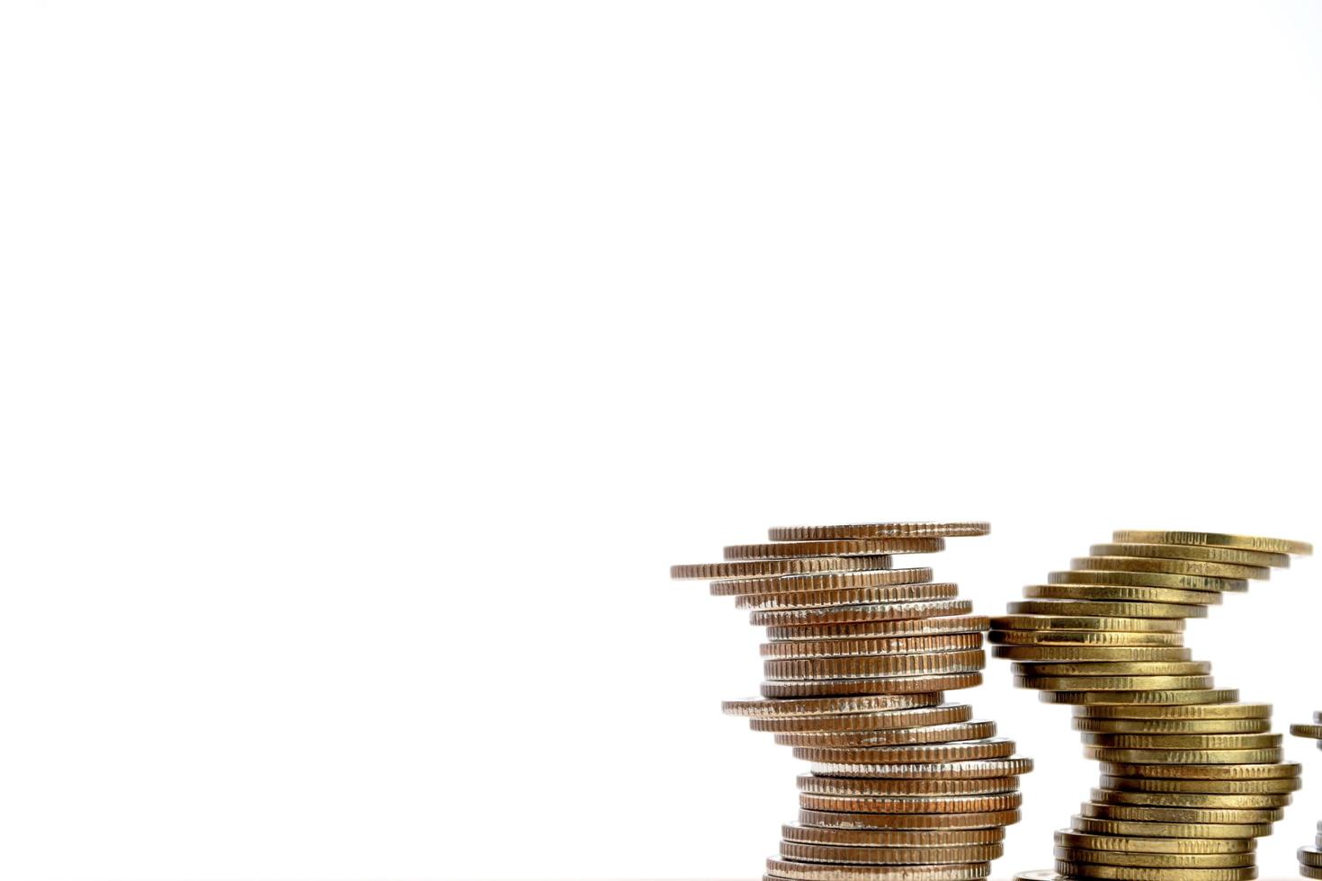 Stack of coins isolated on white background, with copy space.. photo