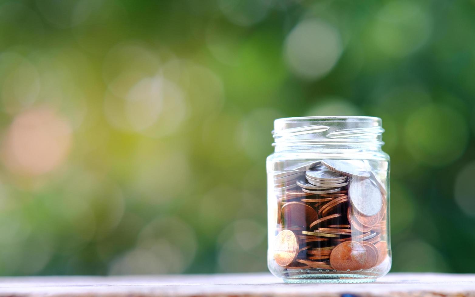 Coins on table background and saving mone photo