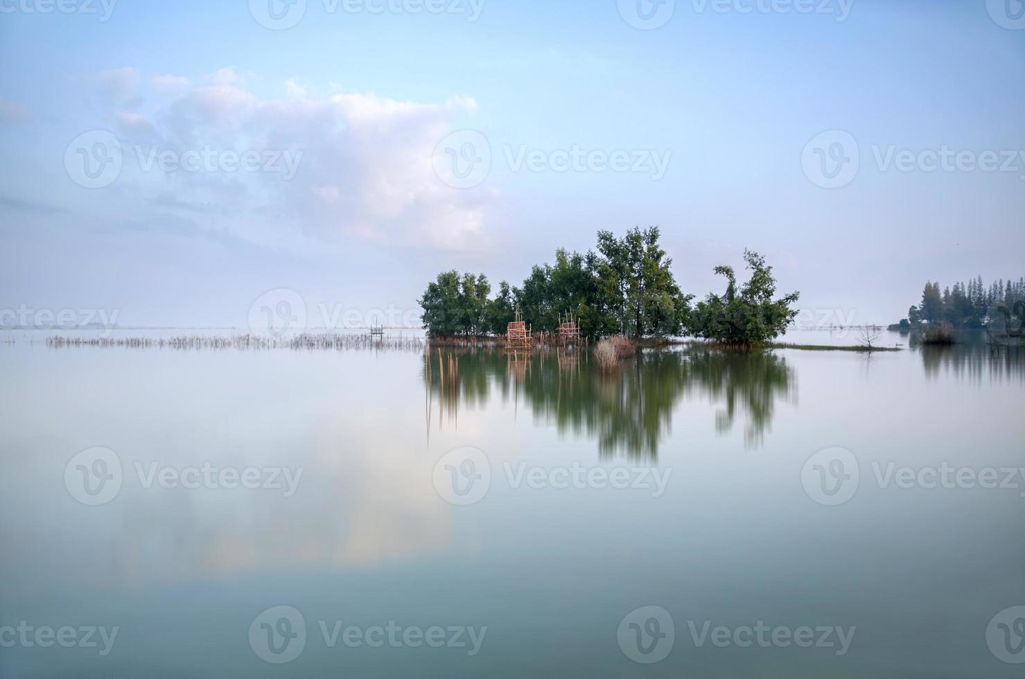 Fisherman house in the middle of lake. photo