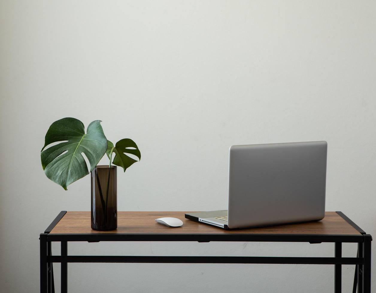 workspace white wall minimal with notebook and desk photo