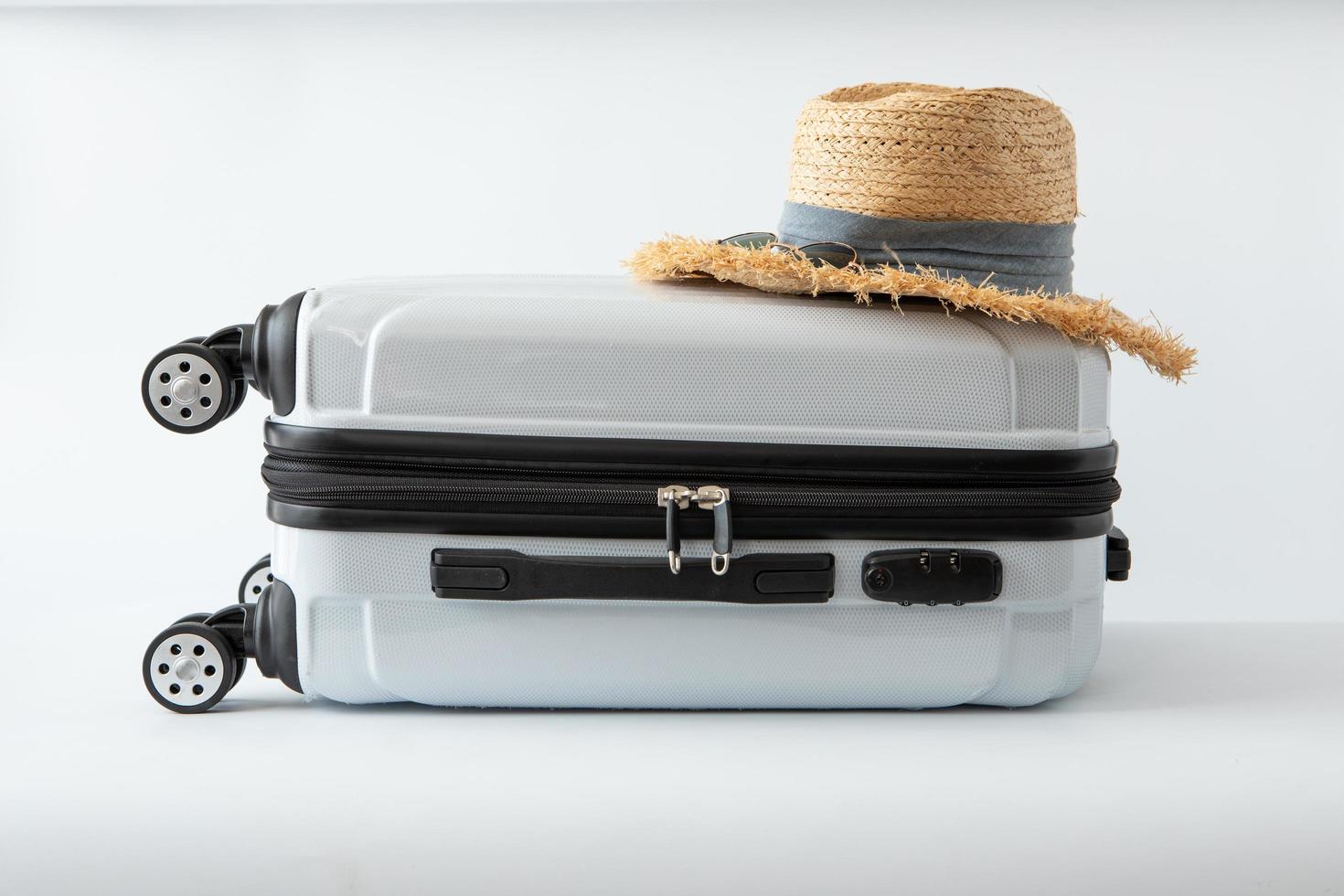 white luggage hat travel journey to destination long weekend holiday photo