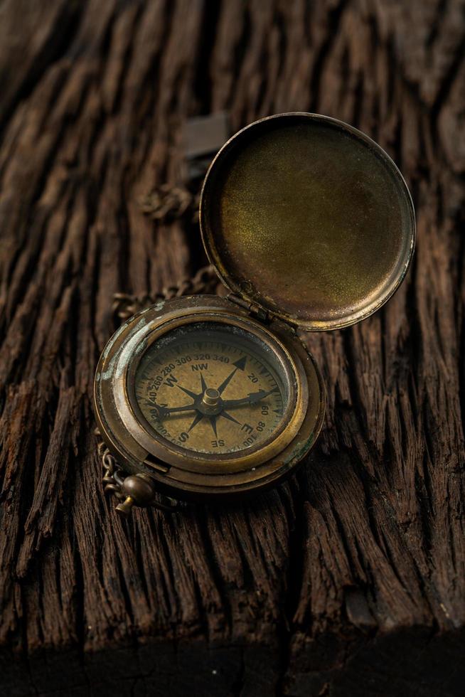 compass navigator journey travel to destination on wwod background photo