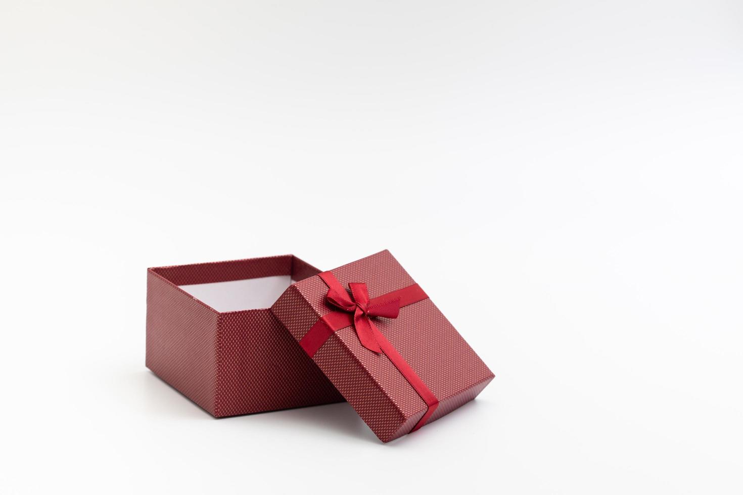 present box with color ribbon on white background photo