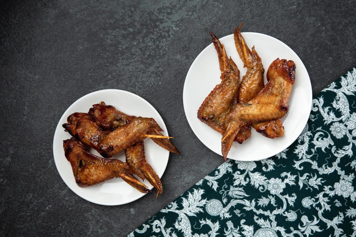 grilled chicken bbq Thai street food style with Thai pattern fabric photo