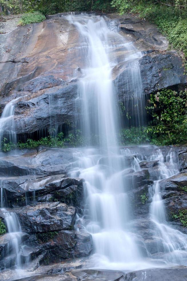 Water flowing at a beautiful waterfall photo