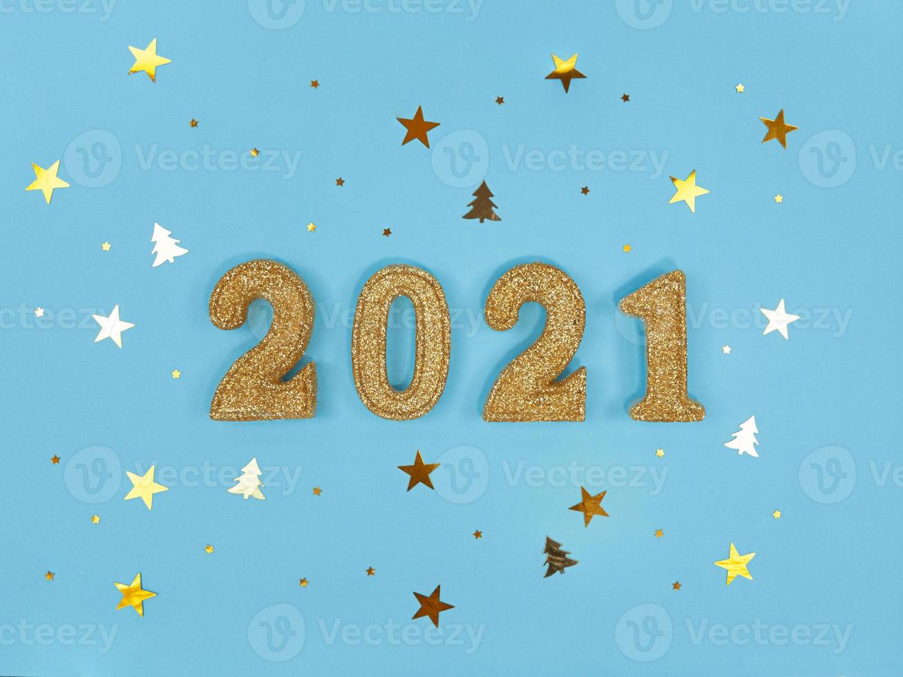 Greeting card of New Year 2021. Golden glittered figures and confetti photo