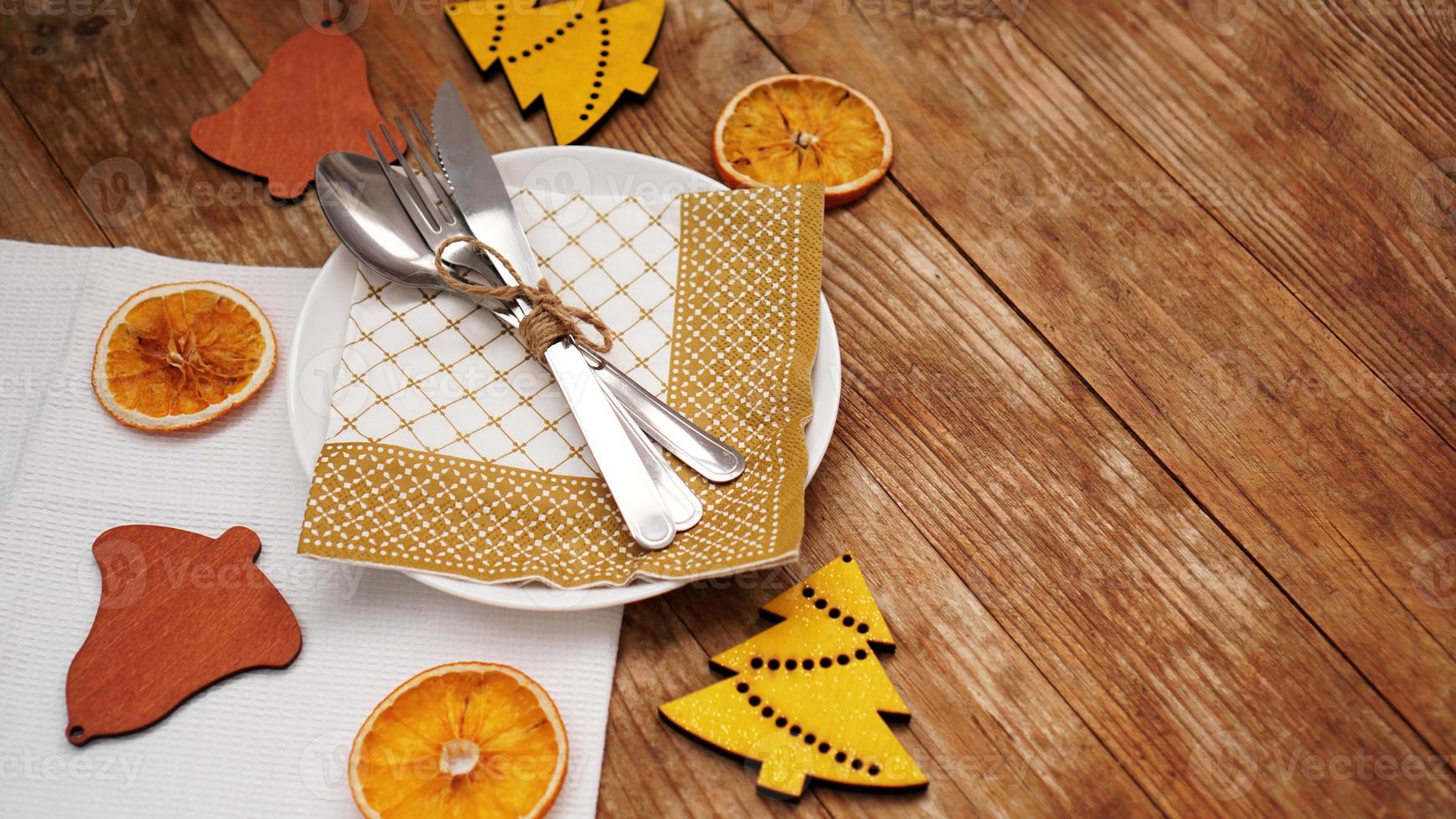 Overhead view of table setting over wooden table with copy space photo