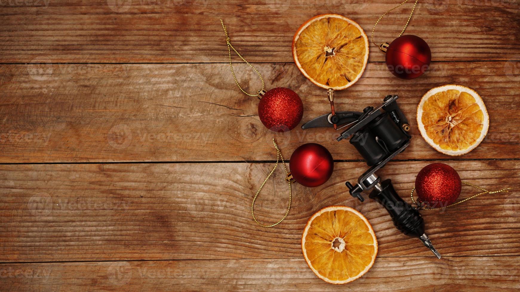 Tattoo machine on a christmas background - christmas decor photo