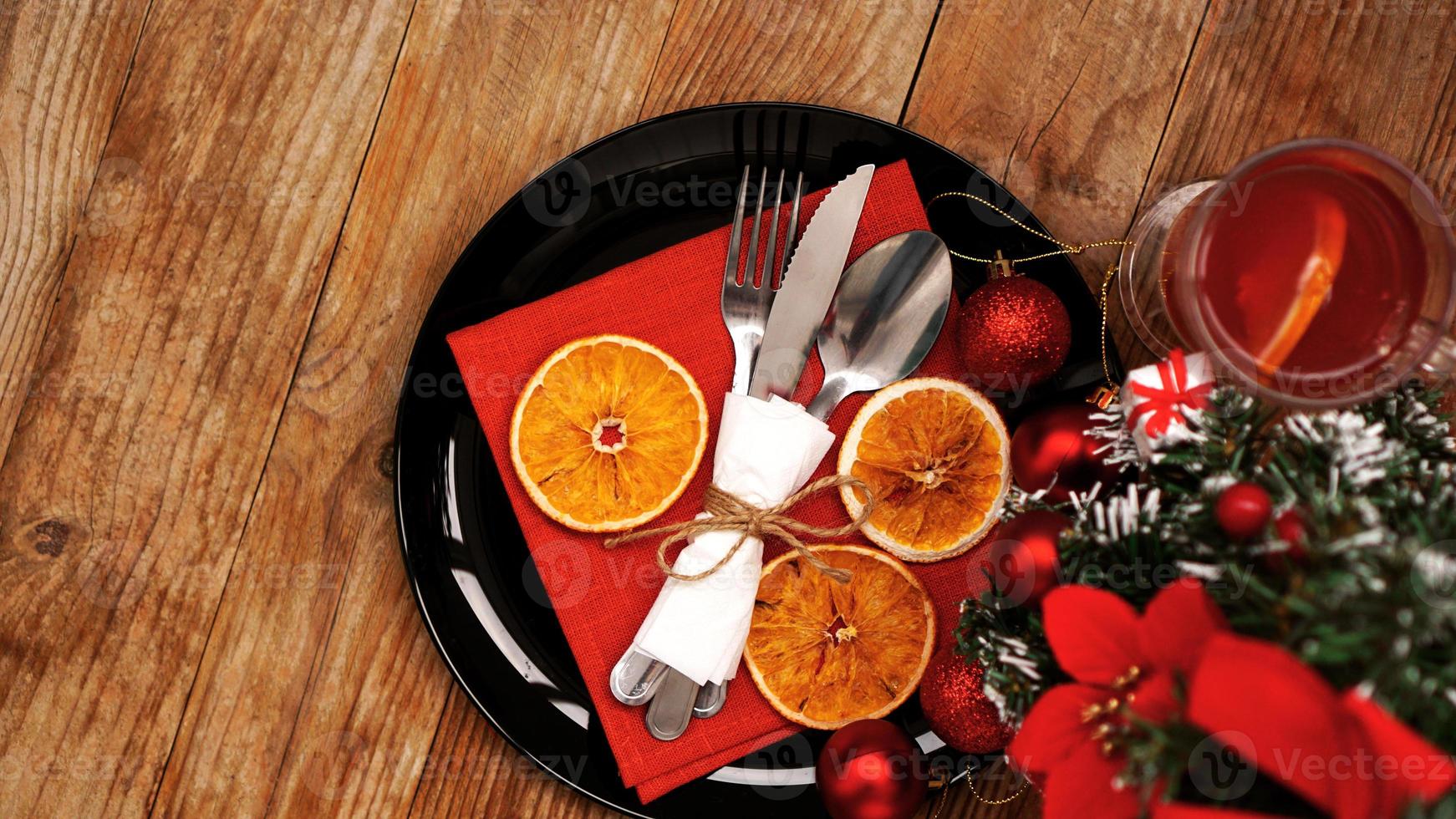 Christmas dinner decoration with dried oranges photo