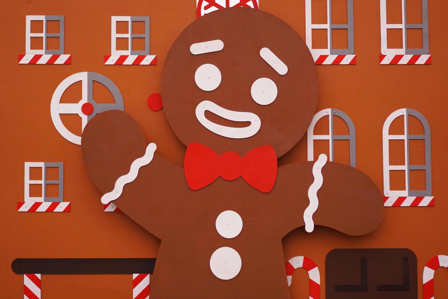 Christmas gingerbread man made of wood. Wooden brown decorations photo