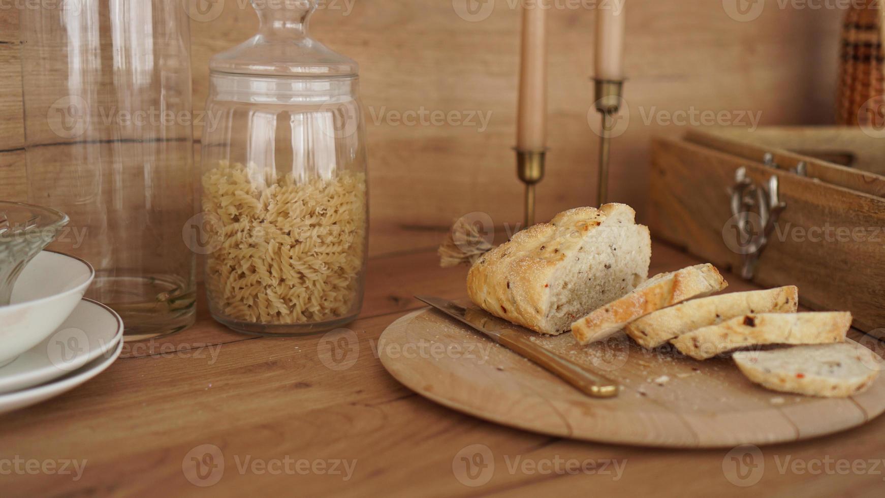 Sliced white bread on a wooden tray. Modern Scandinavian style kitchen photo