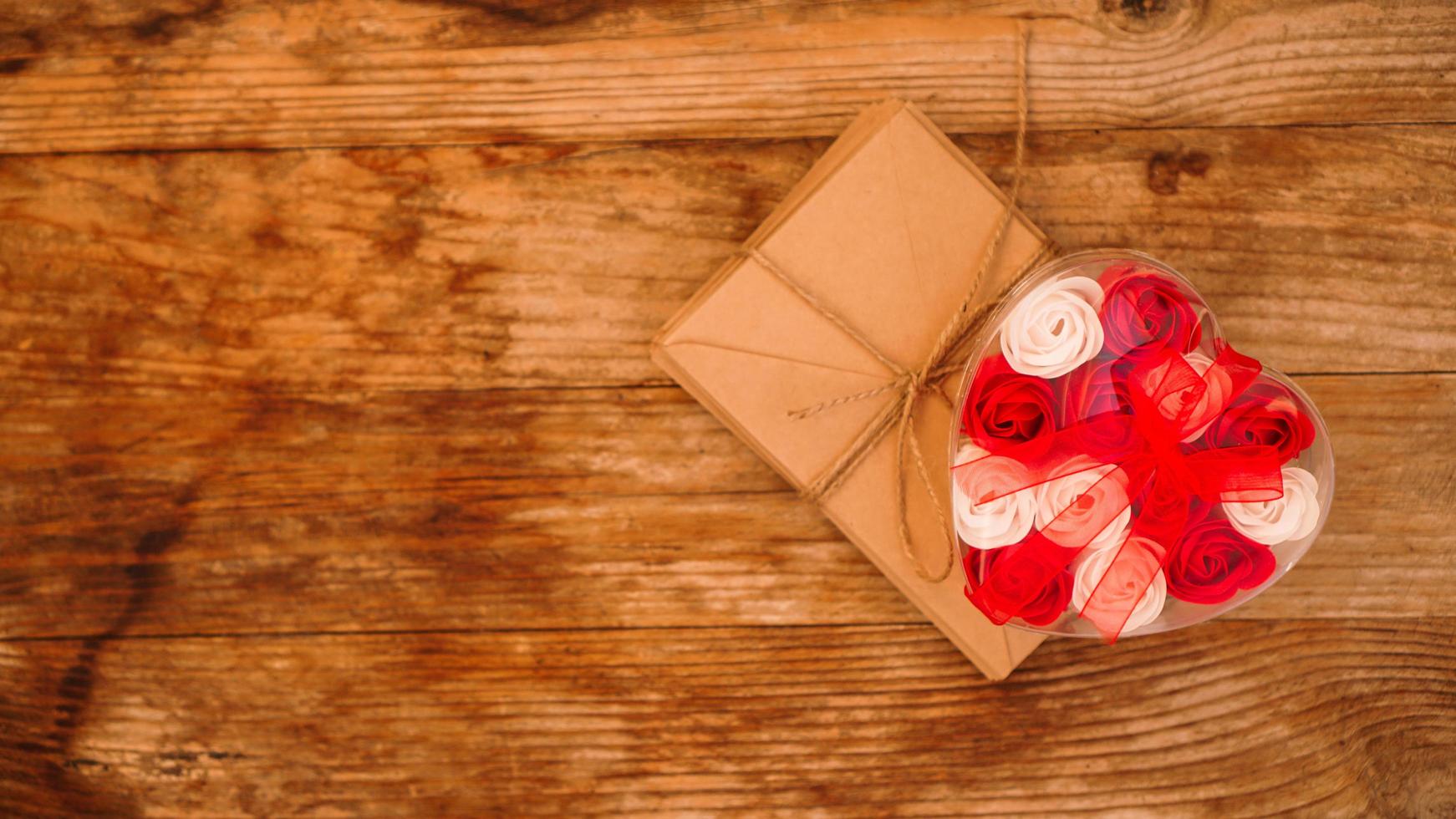 Letters in craft paper envelopes and a gift of roses photo