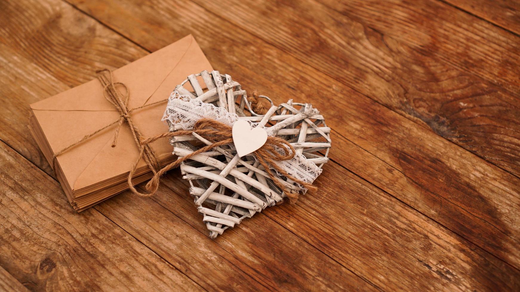 A lot of envelopes from kraft paper tied with string photo