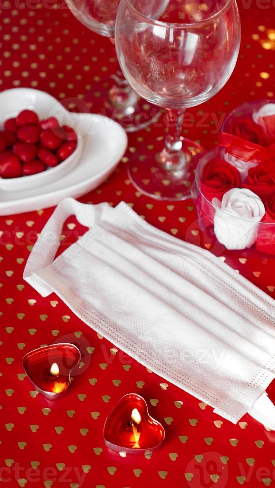 Valentines day concept table. romantic dinner with medical mask photo