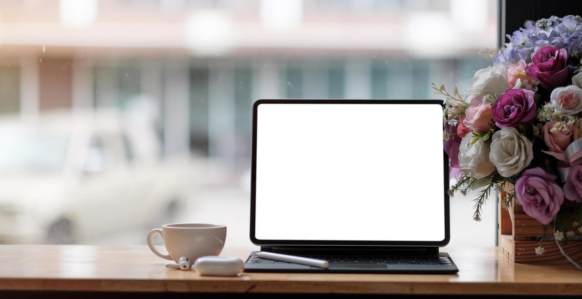 Photo of computer laptop with white blank screen putting on the modern