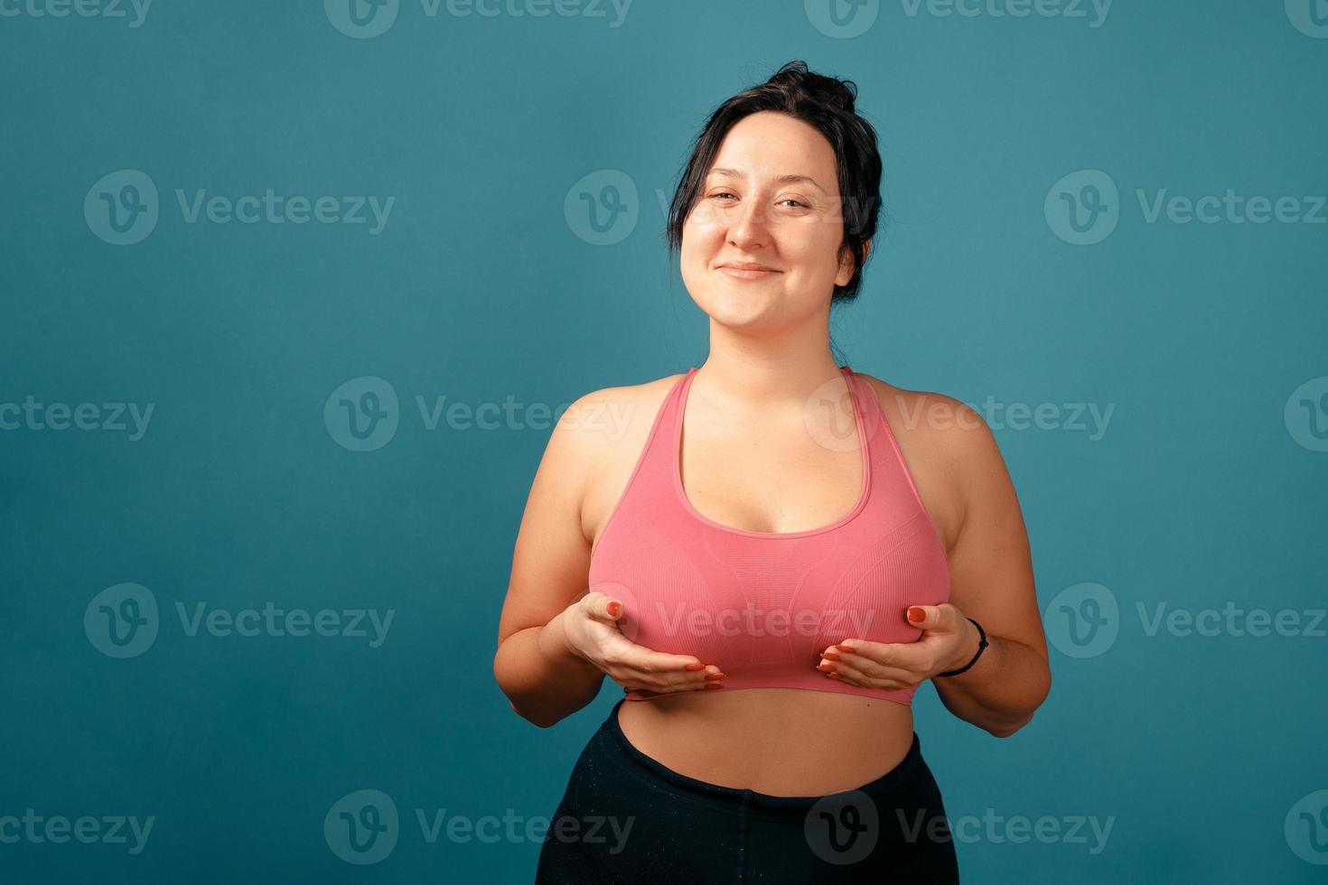 Happy plus size positive woman in studio photo