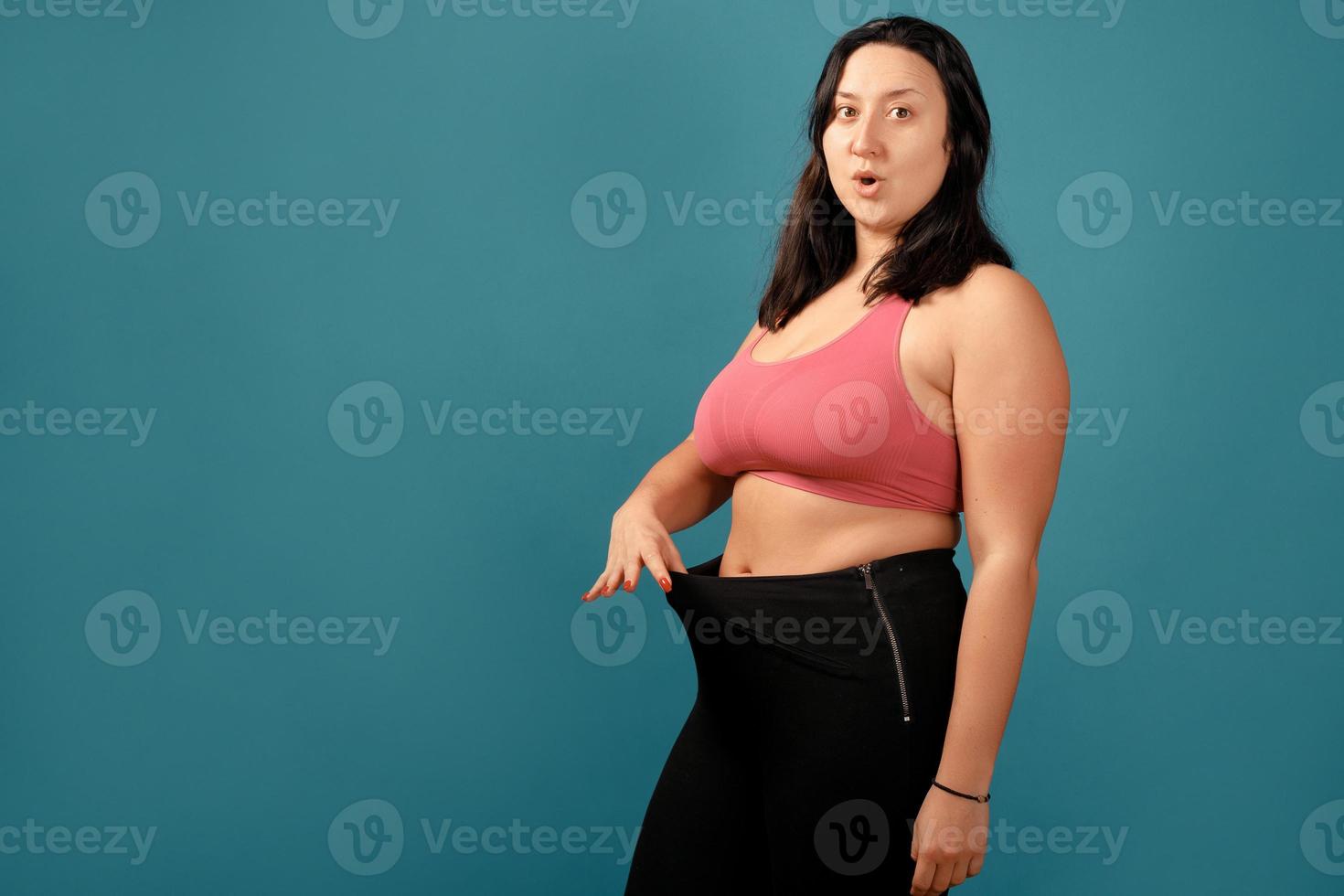 Happy plus size positive woman in studio photo