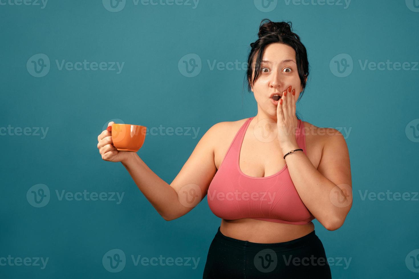 Happy plus size positive woman with cup photo