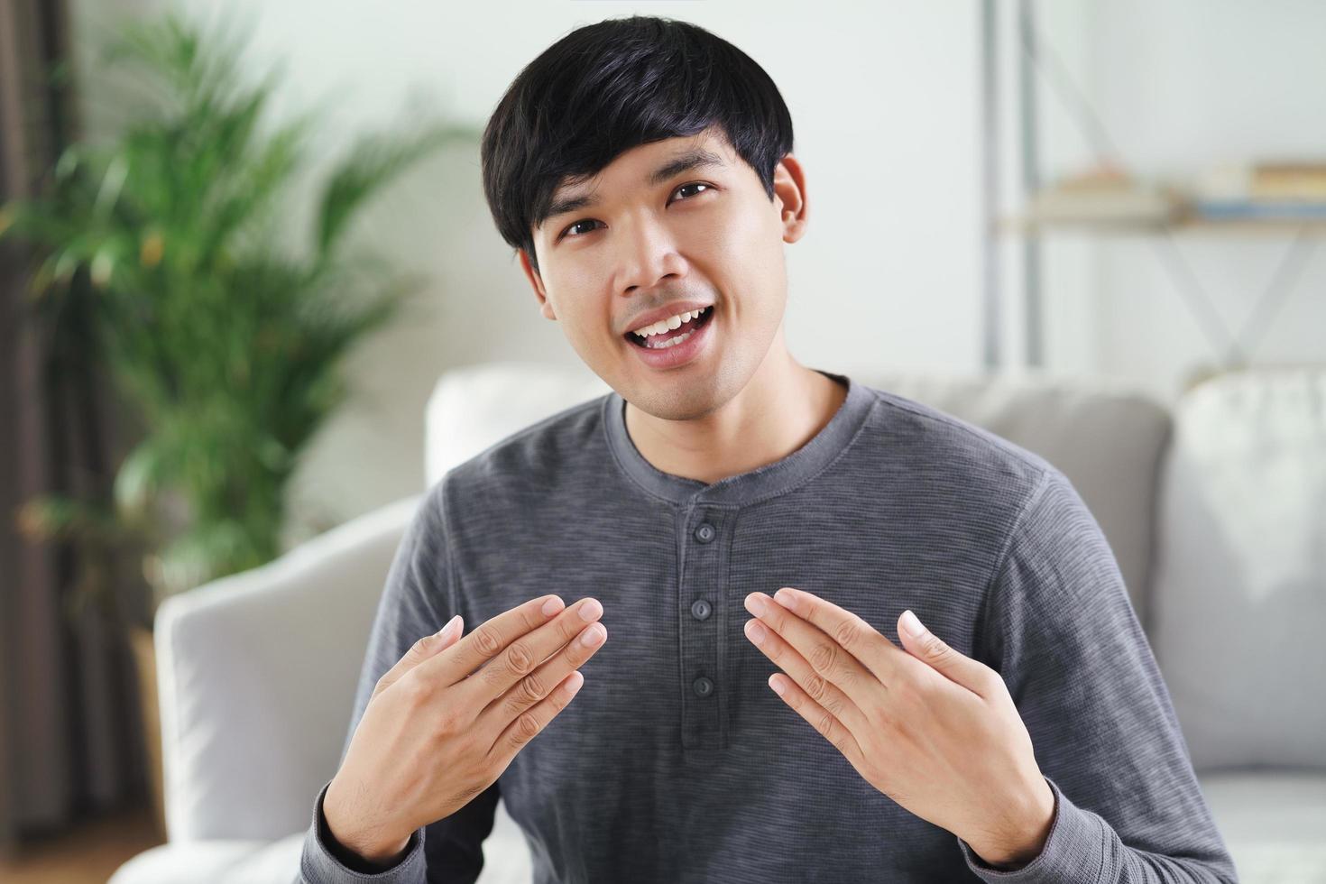 Deaf disabled man use Sign Language to communicate with other people. photo