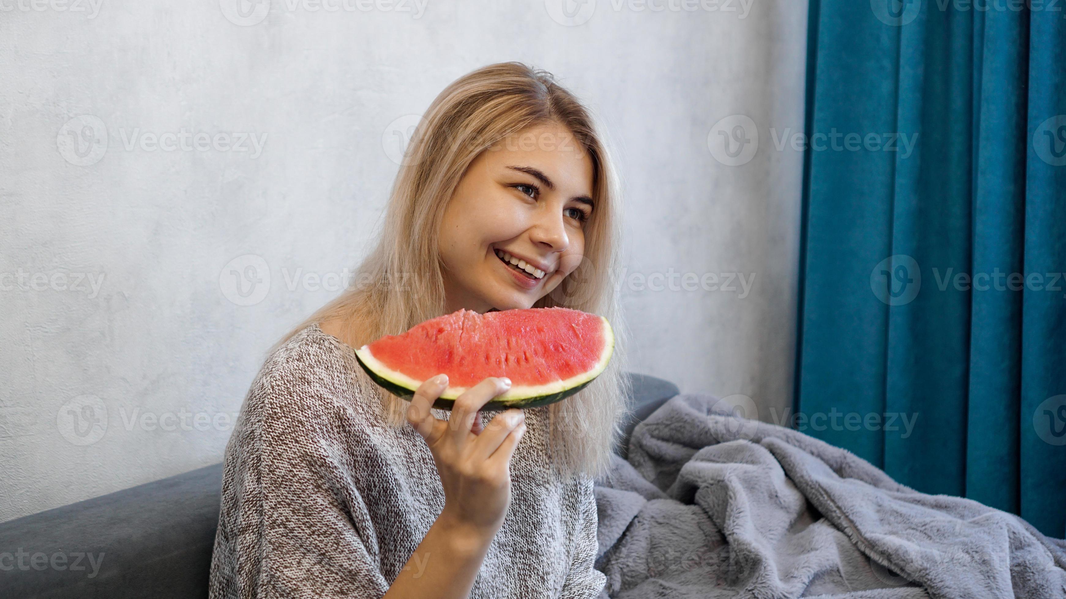 Young attractive woman eating watermelon. Woman at home 3288661 Stock Photo at Vecteezy