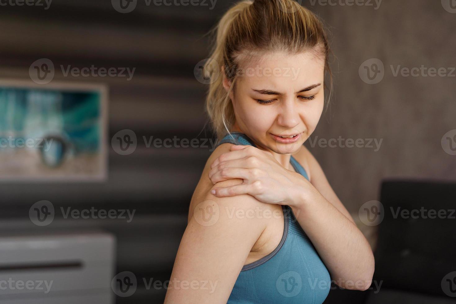 Women wearing athletic suits feeling shoulder pain after exercise photo