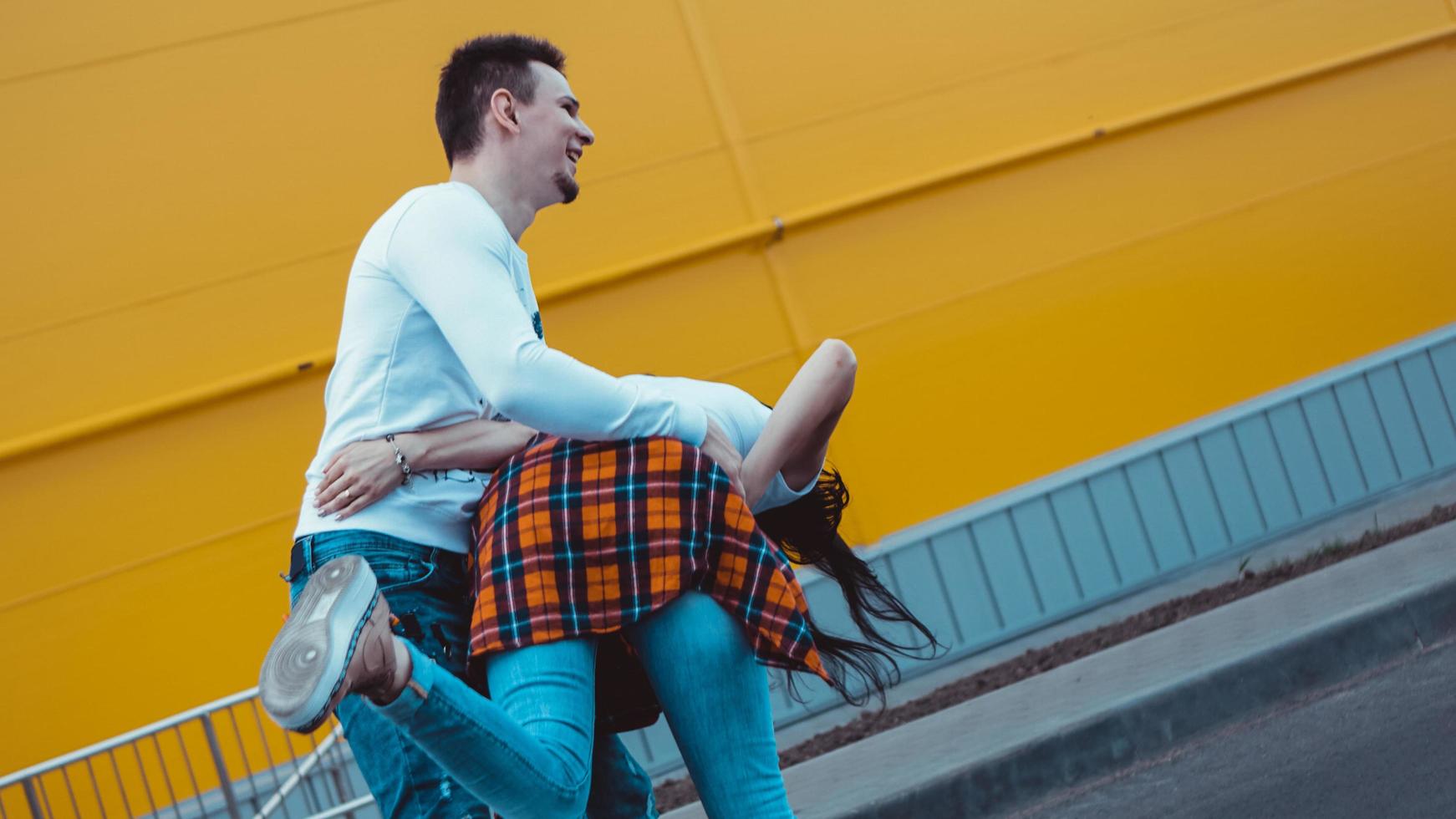 Young smiling couple in love, man holding attractive woman hand photo