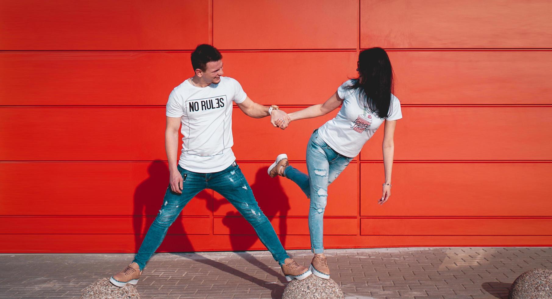 Young smiling couple in love, man holding attractive woman hand photo