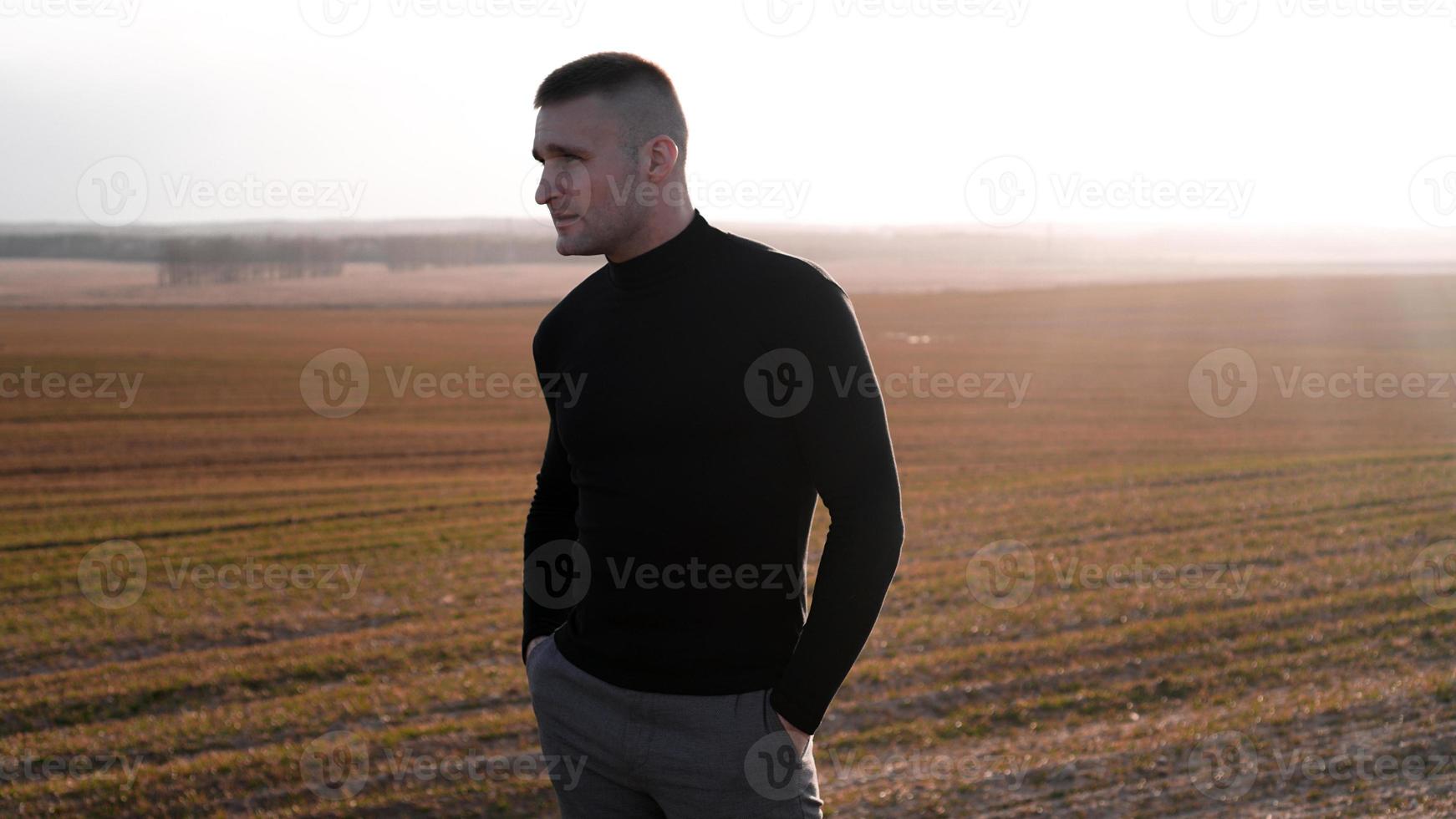 Outdoor portrait of young handsome smiling man photo