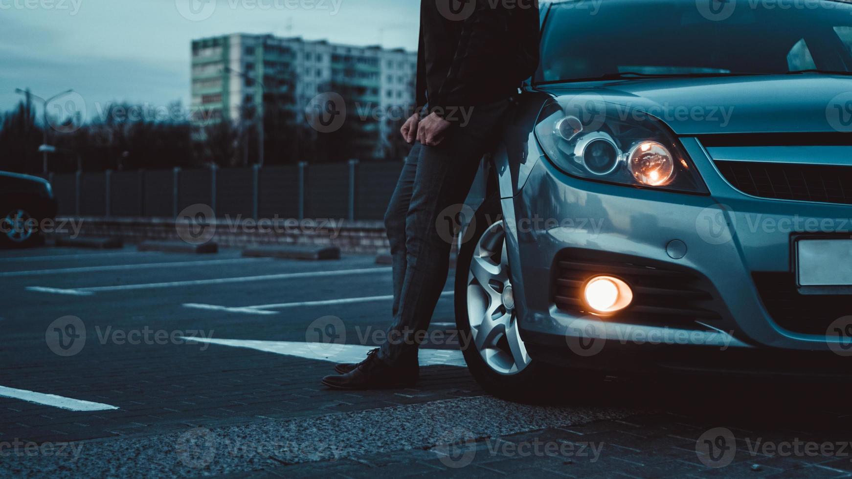 Close up of modern sedan headlamp photo