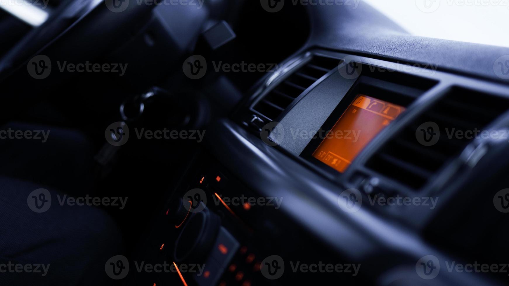 Buttons of radio, dashboard, climate control in car close up photo