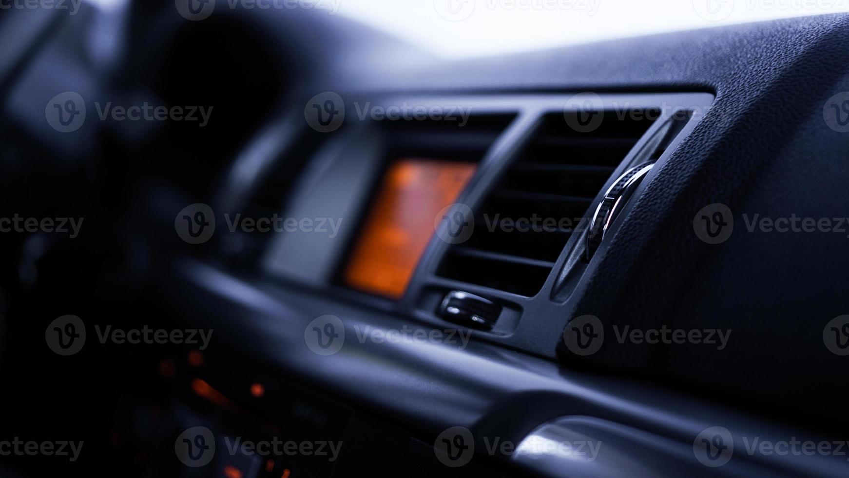 Buttons of radio, dashboard, climate control in car close up photo