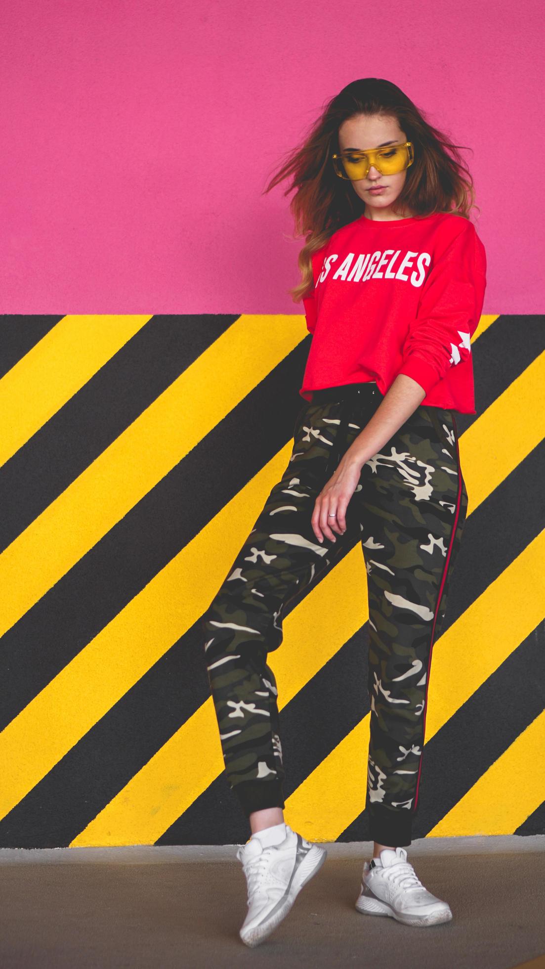 Fashion model wearing red hoodie posing at parking 3289128 Stock Photo