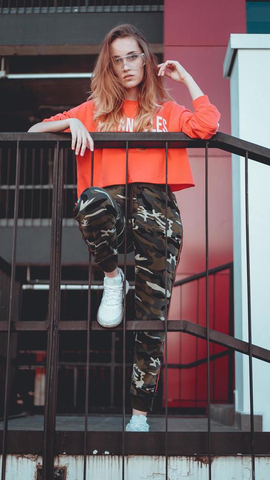 Fashion model wearing red hoodie with inscription los angeles photo