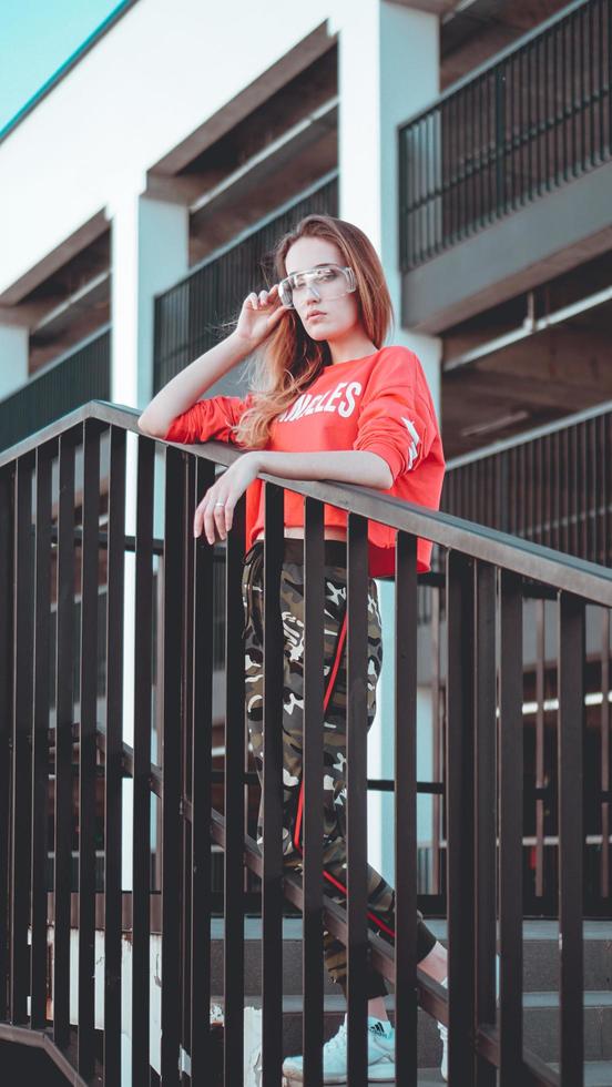 Fashion model wearing red hoodie with inscription los angeles photo